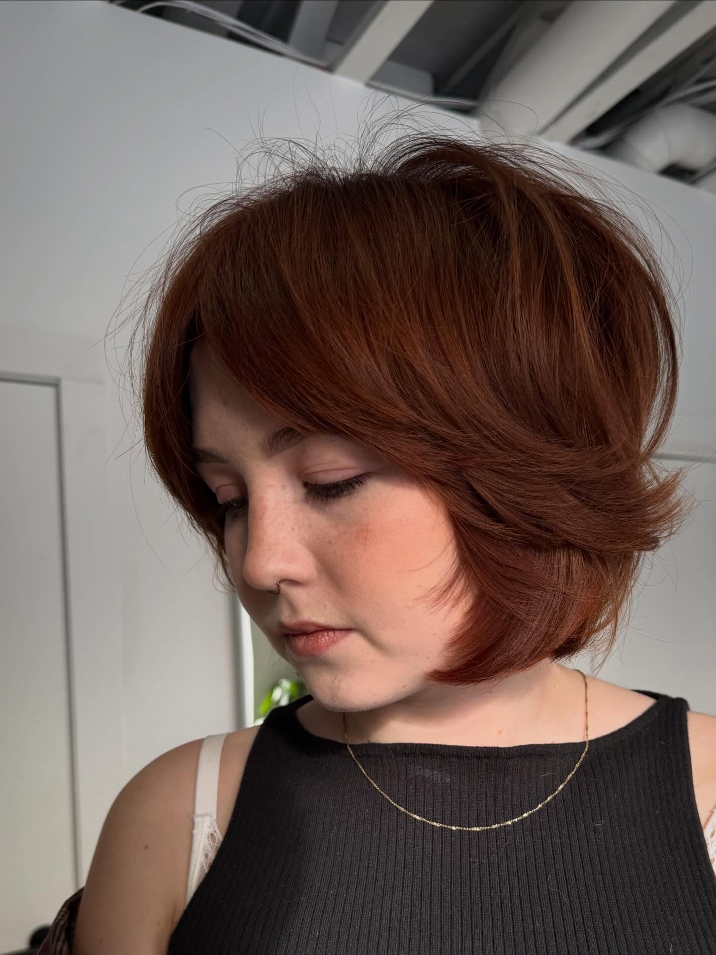 Copper Feathered Chin-Length Bob with Stacked Internal Graduation