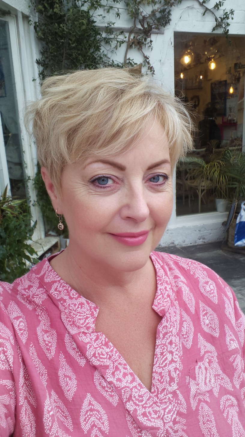 Short Feathered Blonde Pixie with Tapered Nape