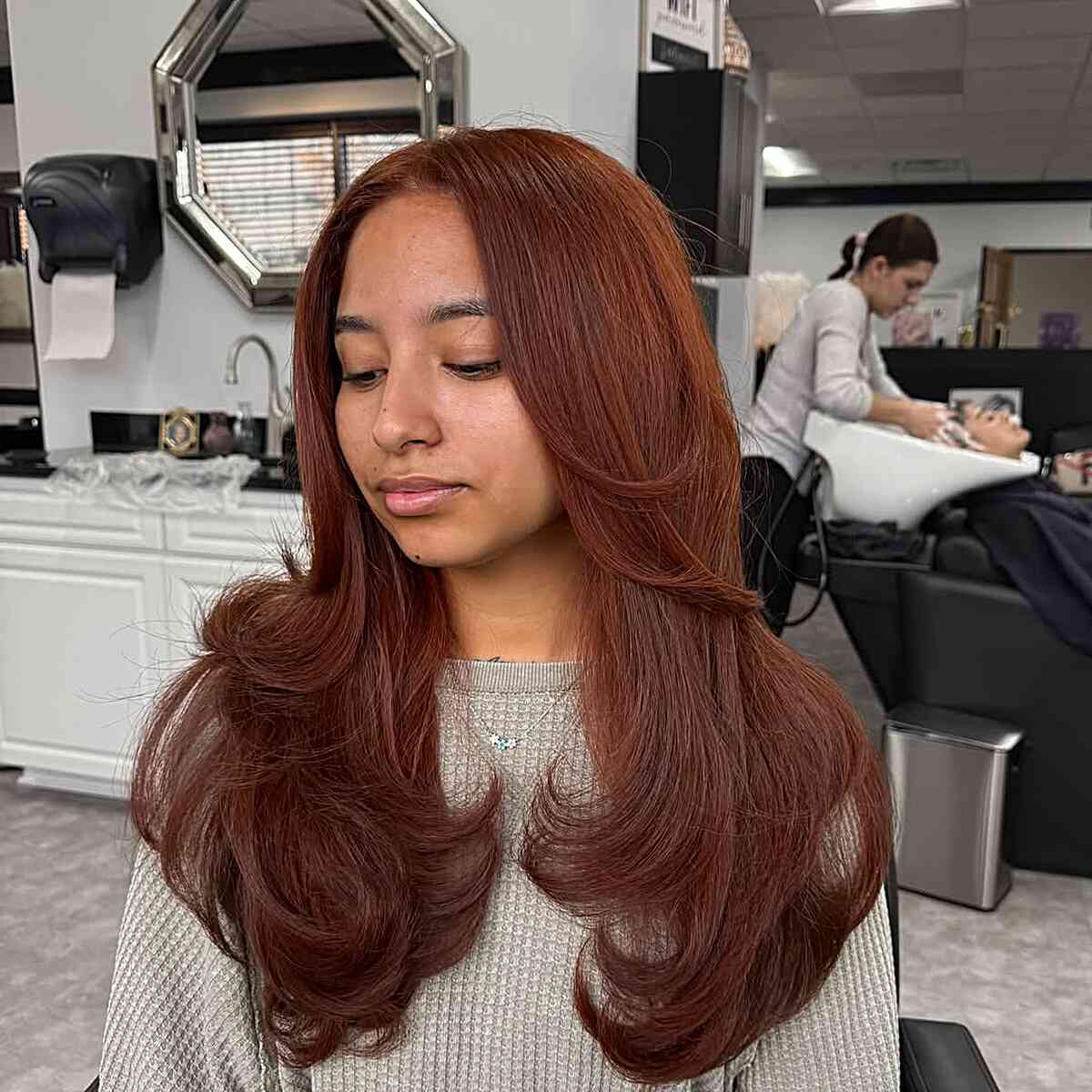 Luxurious Copper Waves with Face-Framing Layers
