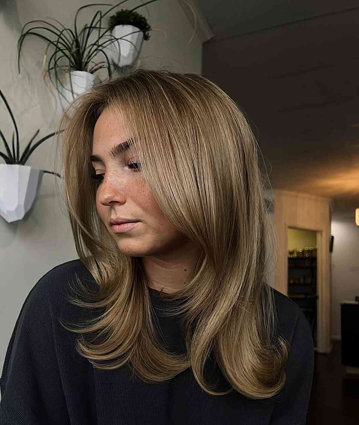 Soft Layered Dark Blonde Cut with Face-Framing Layers
