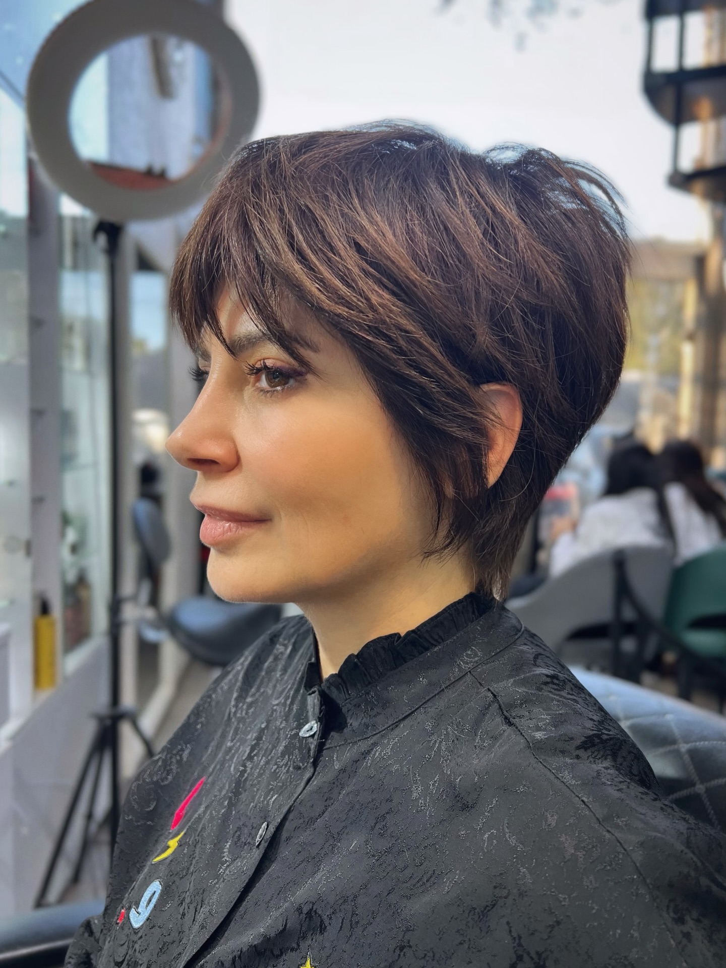 Feathered Chestnut Pixie with Micro-Bangs and Crown Graduation