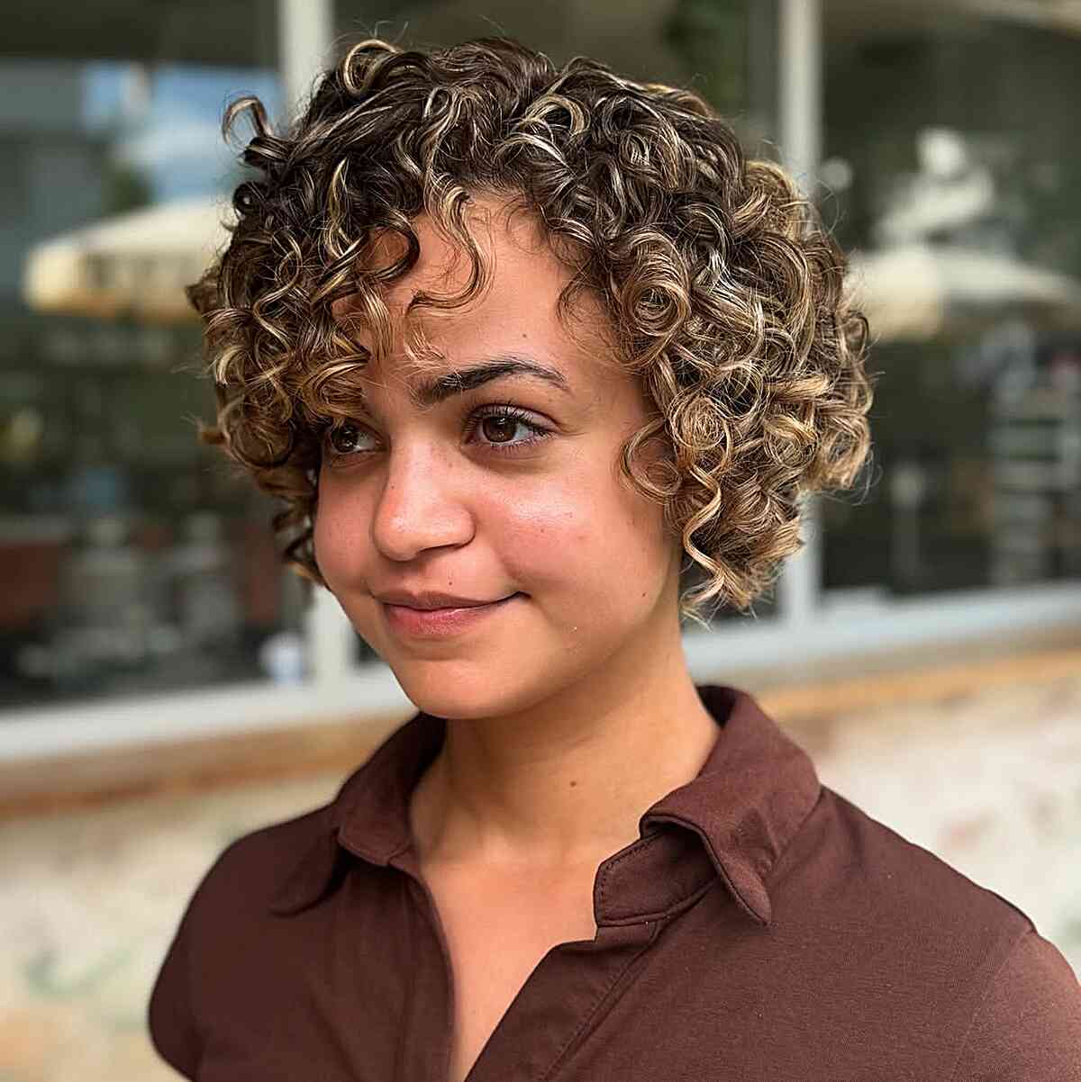 Playful Blonde Curly Bob with Highlights