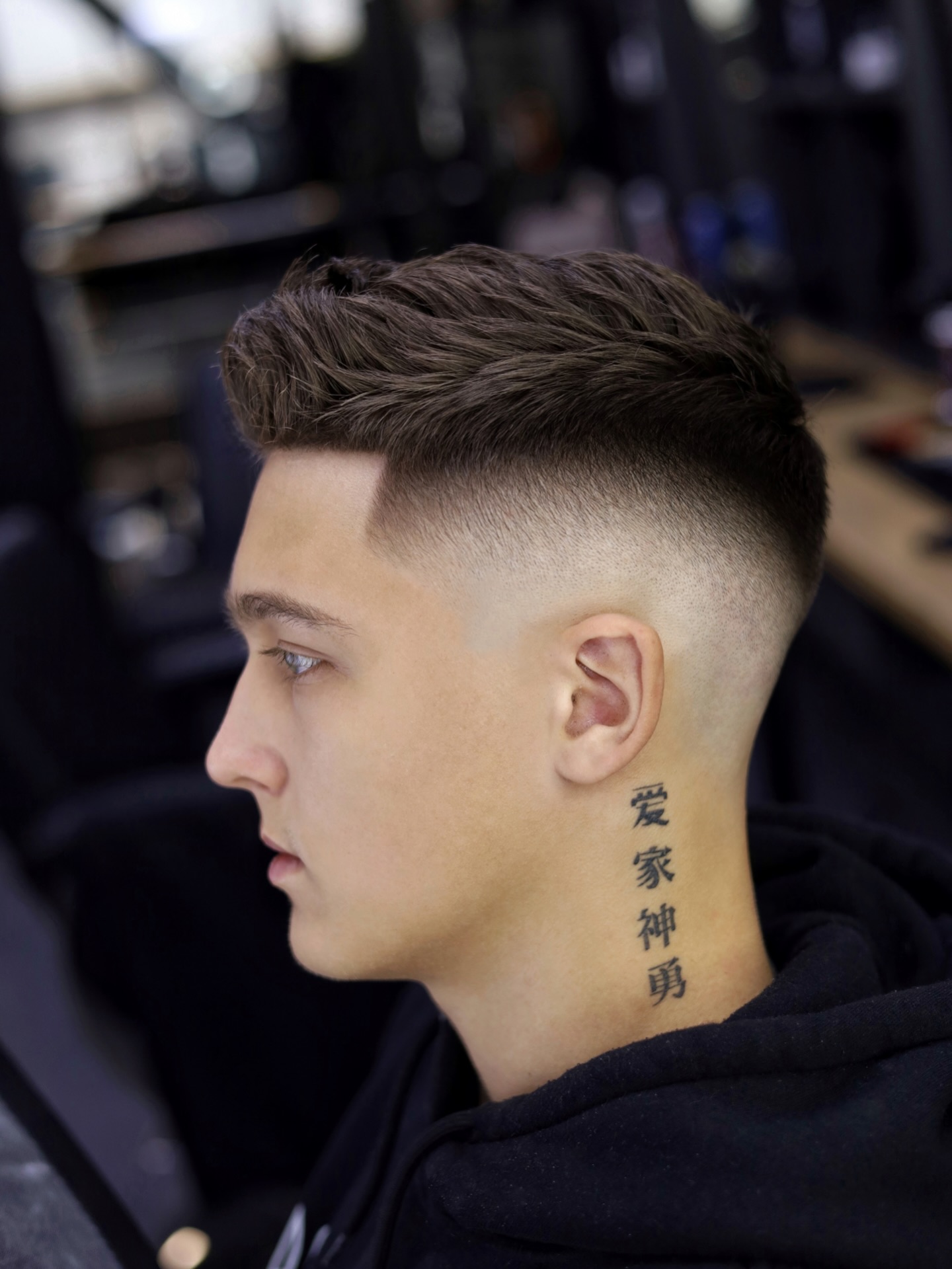 Tapered Skin Fade with Brushed Top and Defined Temple Block
