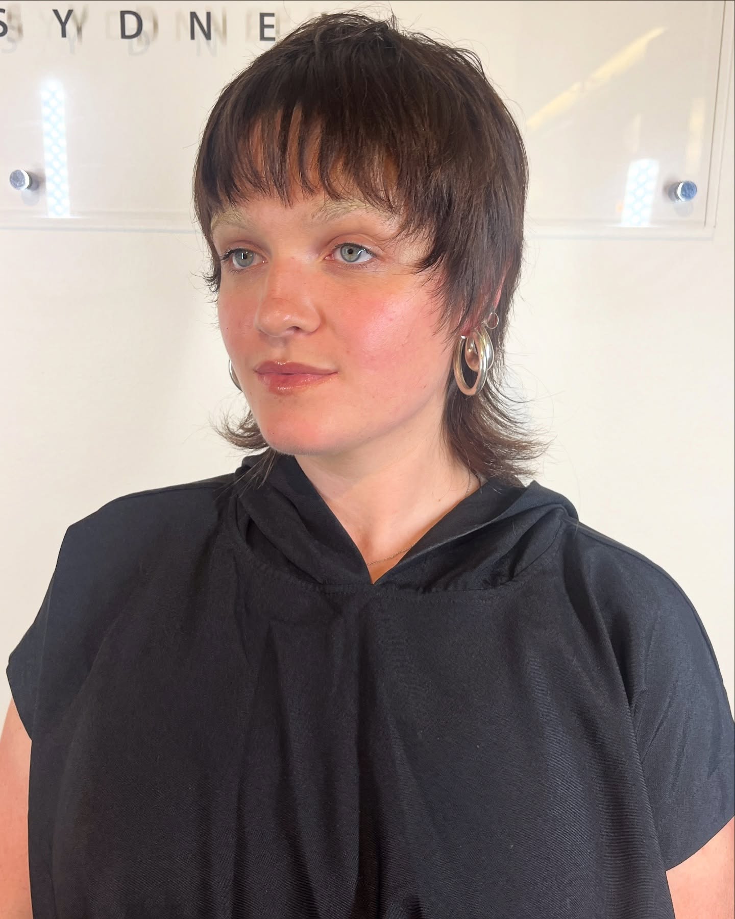 Cropped Layered Mullet with Brushed Micro Bangs and Flared Nape
