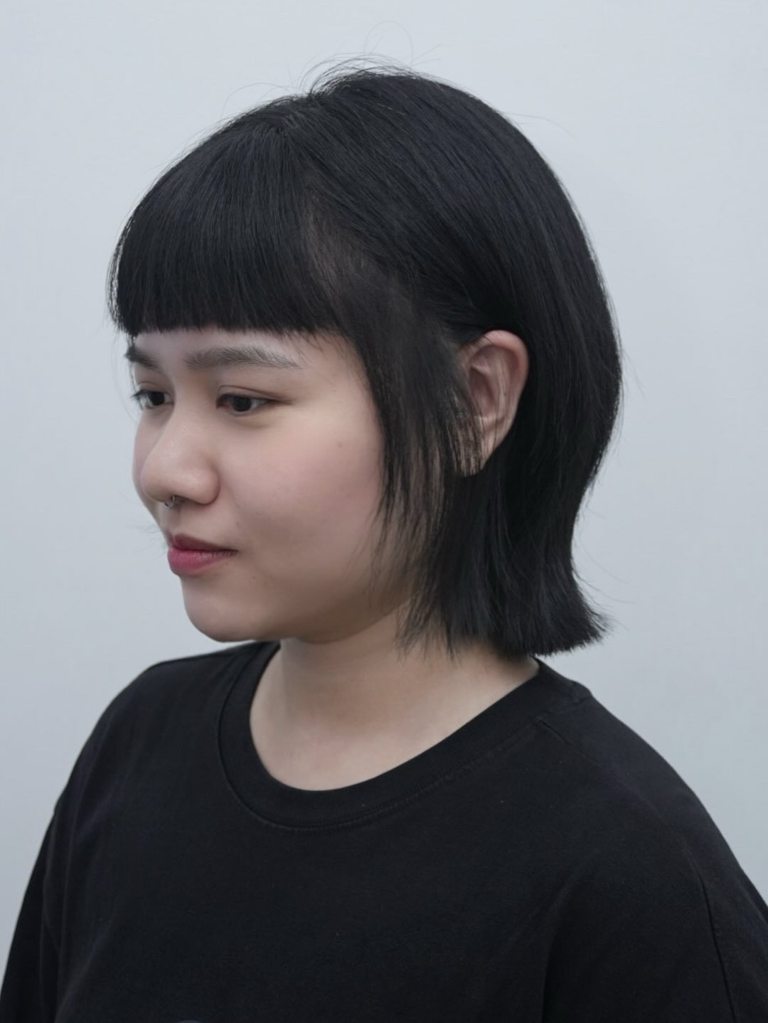 Edgy Nape-Length Mullet with Blunt Micro Fringe and Face-Framing Tapers