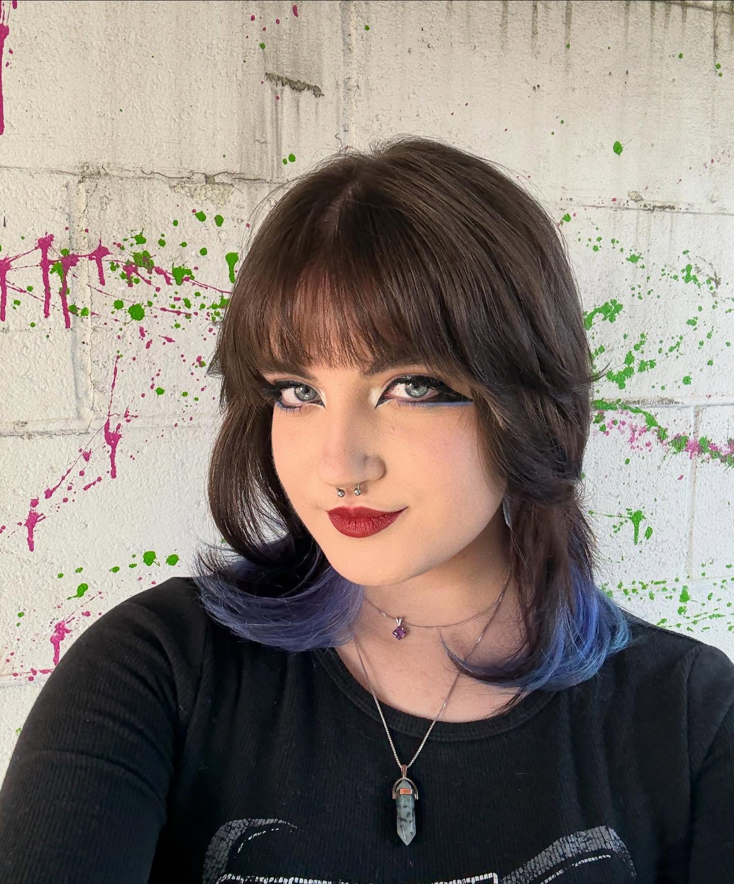 Shaggy Short Cut with Feathered Curtain Bangs and Violet Peekaboo Ends