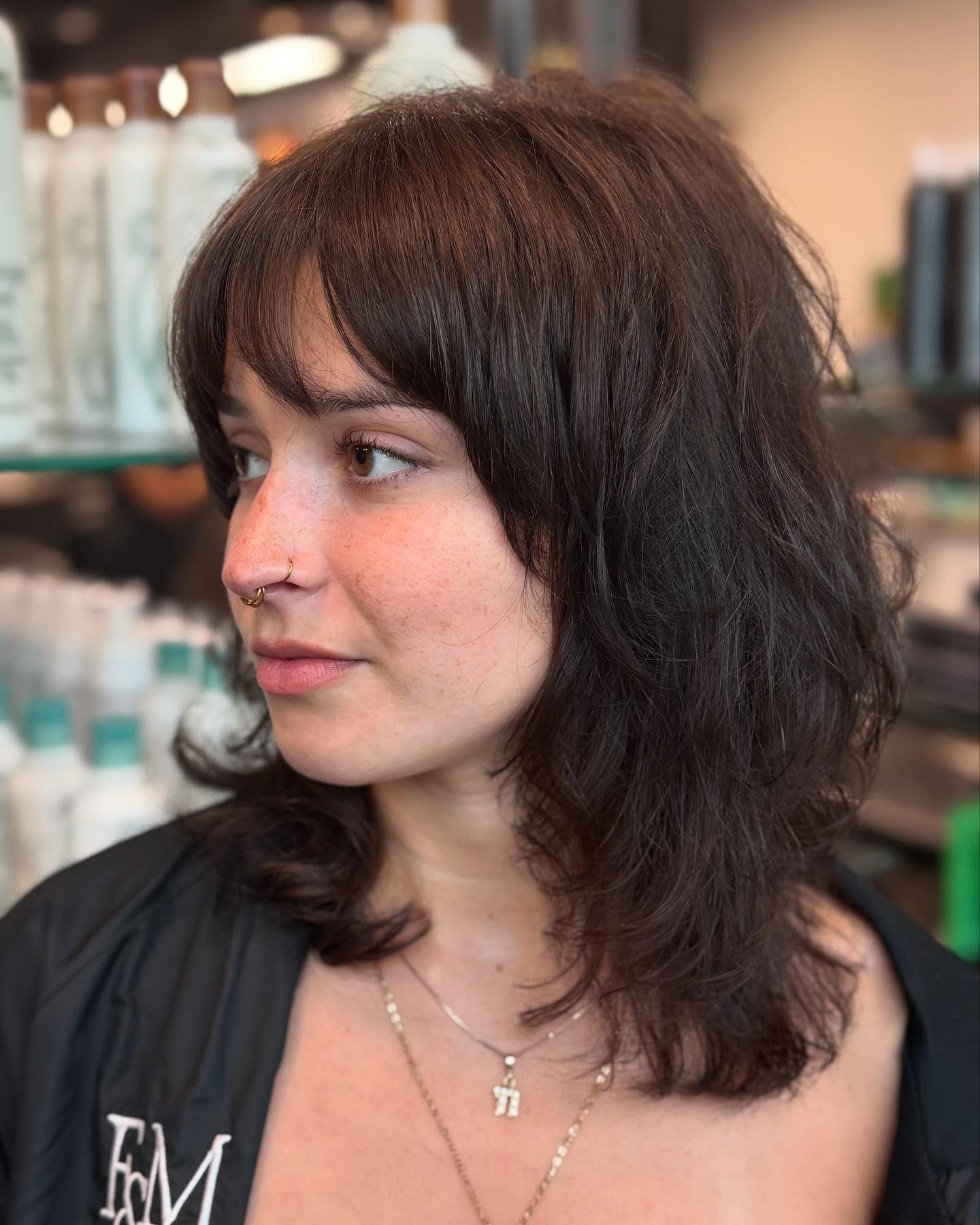 Tousled Shoulder-Length Shag with Wispy Fringe