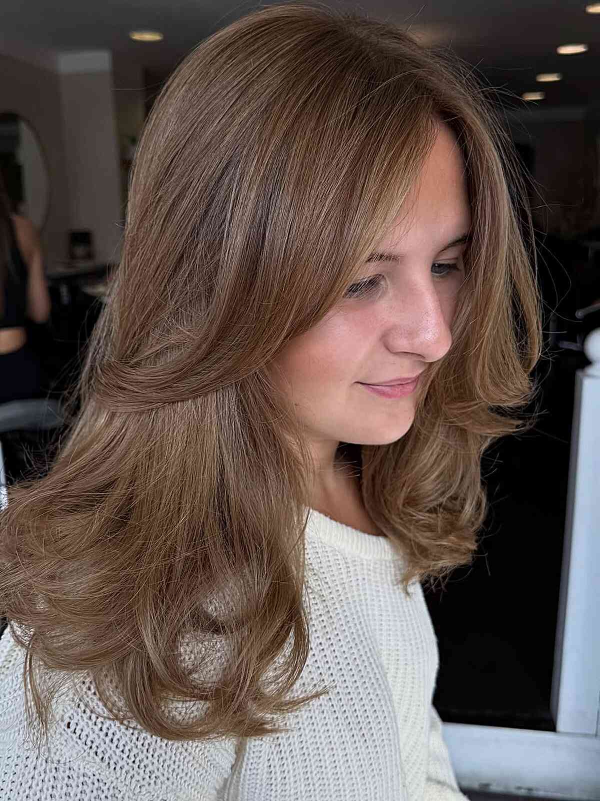 Soft Layered Dark Blonde Cut with Gentle Waves