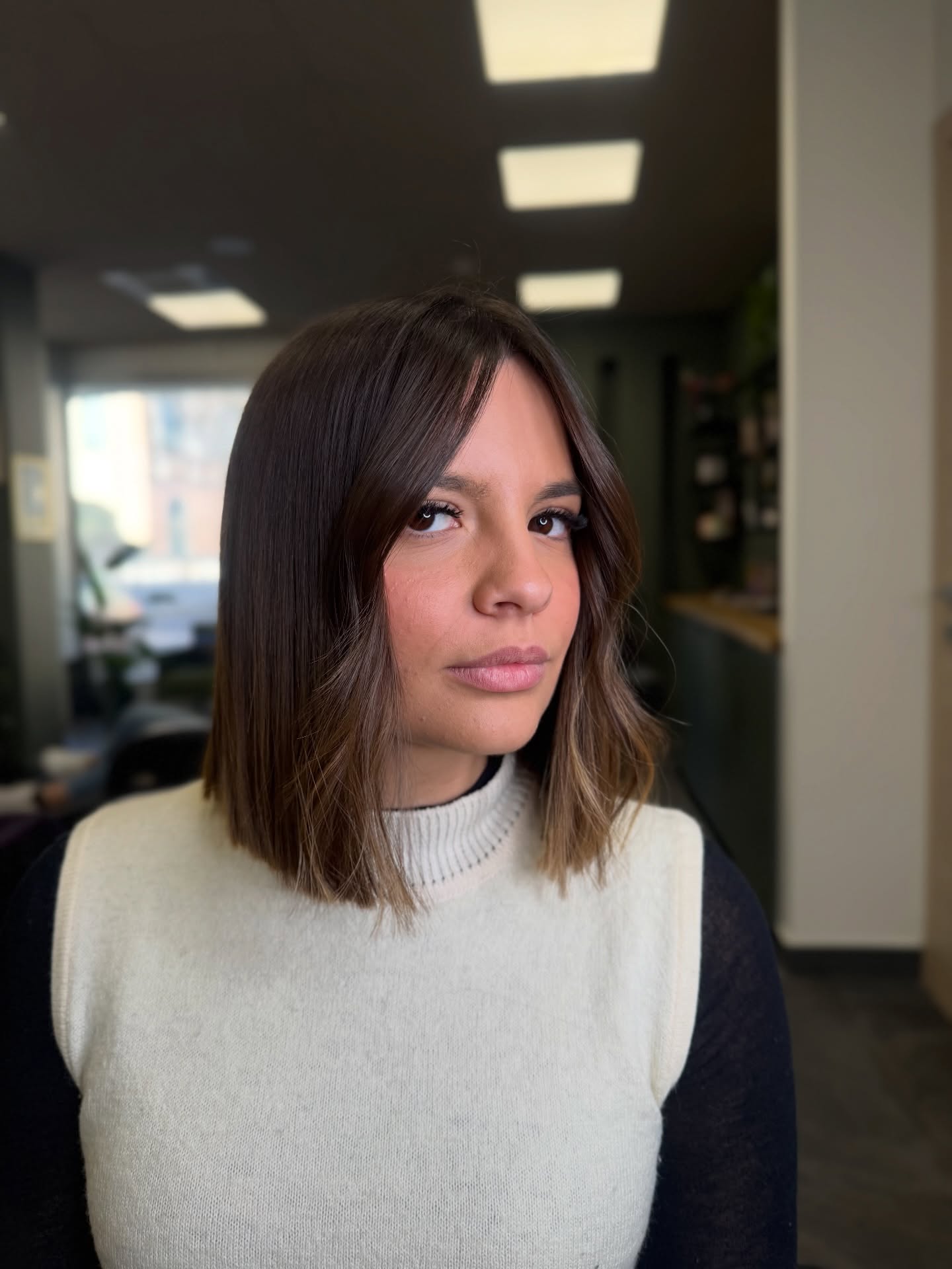 Sleek Chin-Grazing Lob with Rolled Curtain Fringe