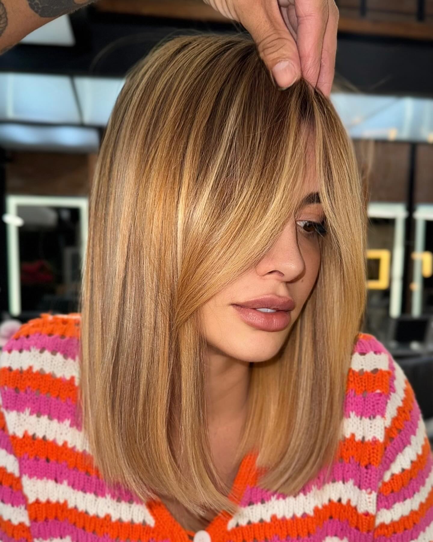 Warm Blonde Collarbone Lob with Long Curtain Fringe