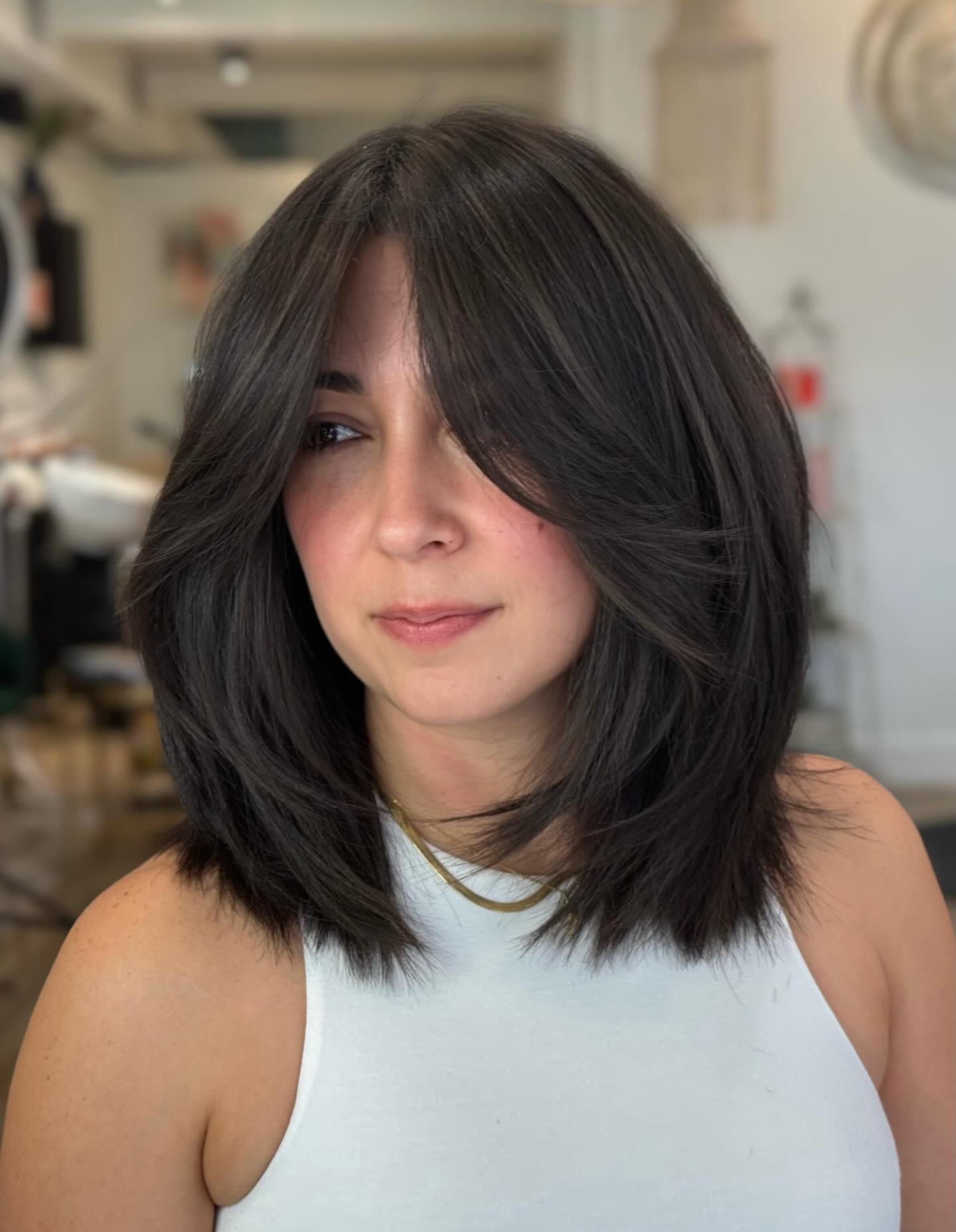 Rounded Mid-Lob with Long Face-Framing Curtain Bangs