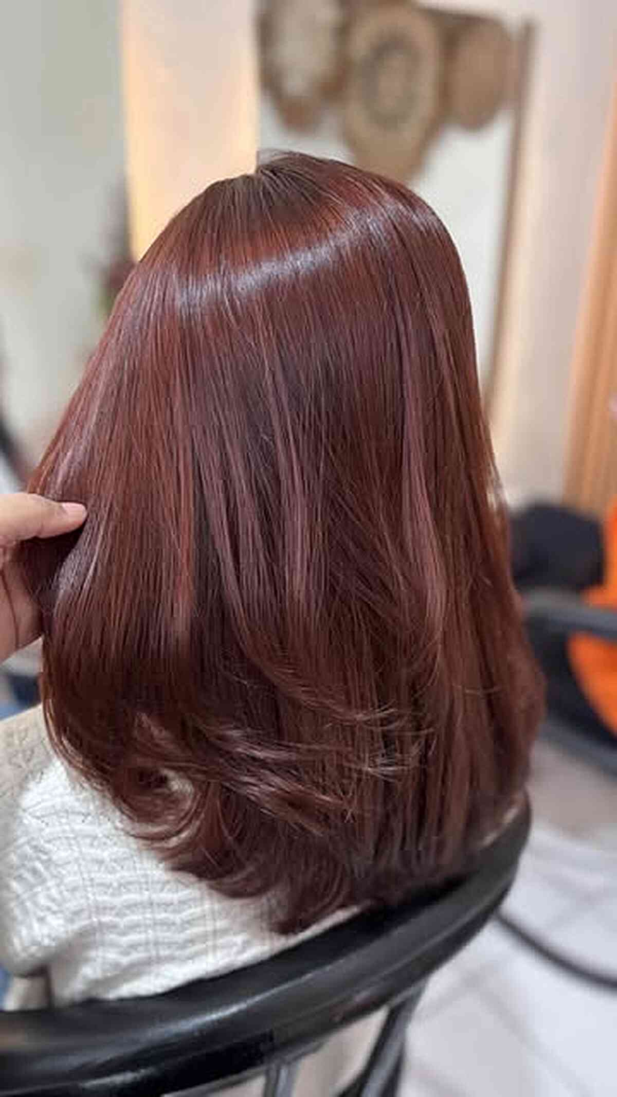 Silky Auburn Layered Midlength Cut