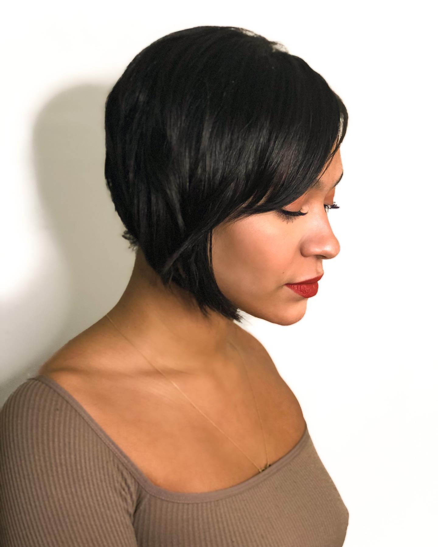 Glossy Angled Pixie-Bob with Deep Side Part and Stacked Nape