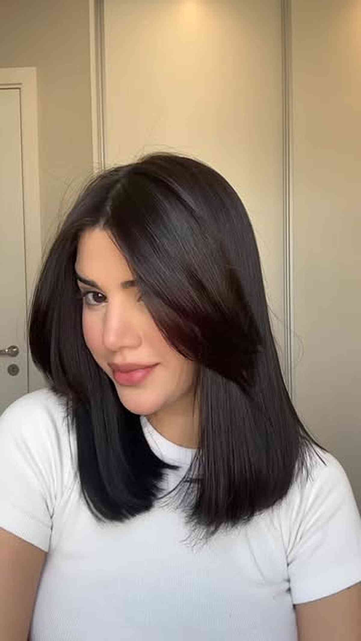 Soft-Layered Midlength Sleek Cut with Curtain Bangs