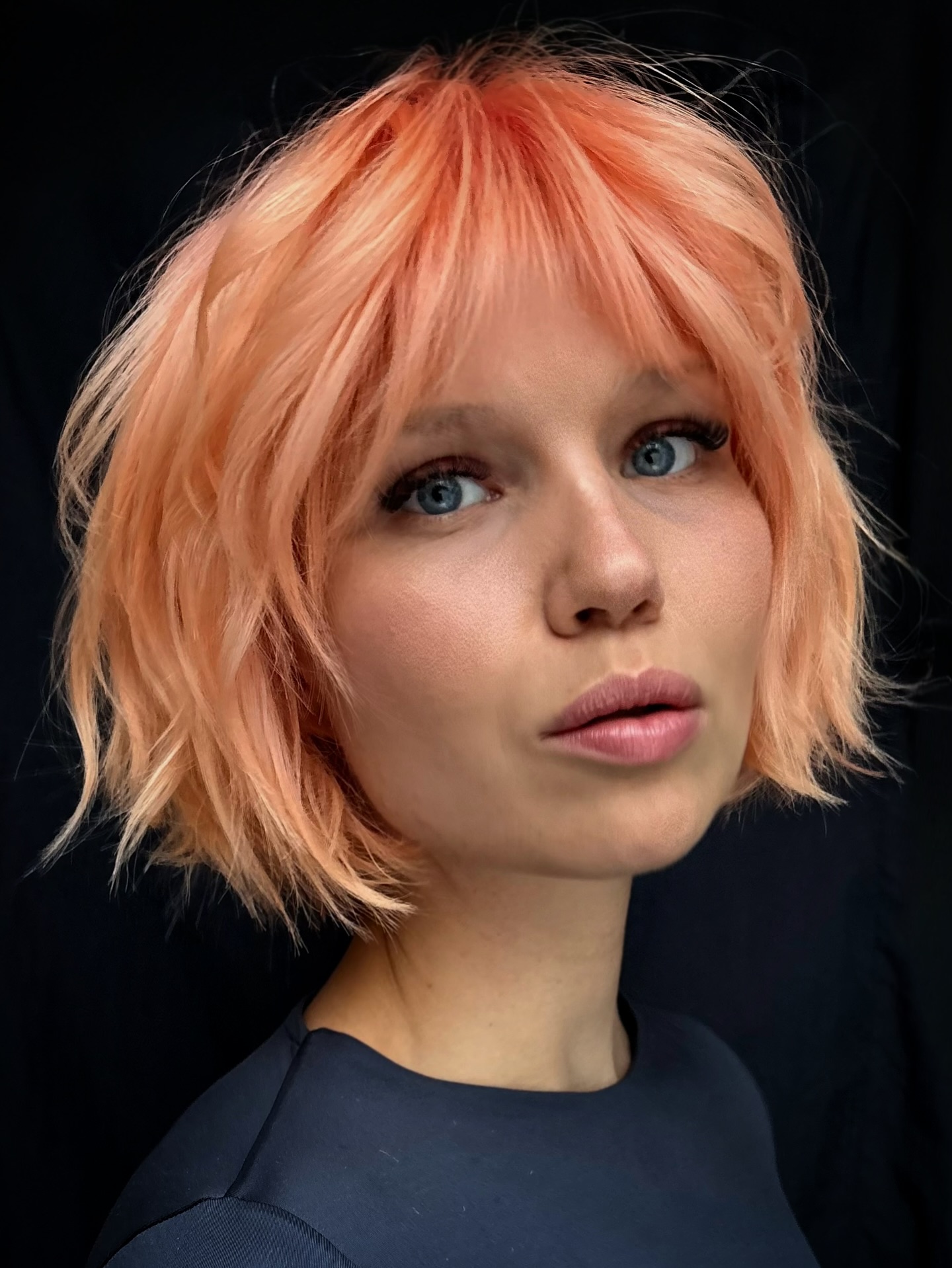 Peach Pastel Choppy Chin-Length Bob with Soft Micro Fringe