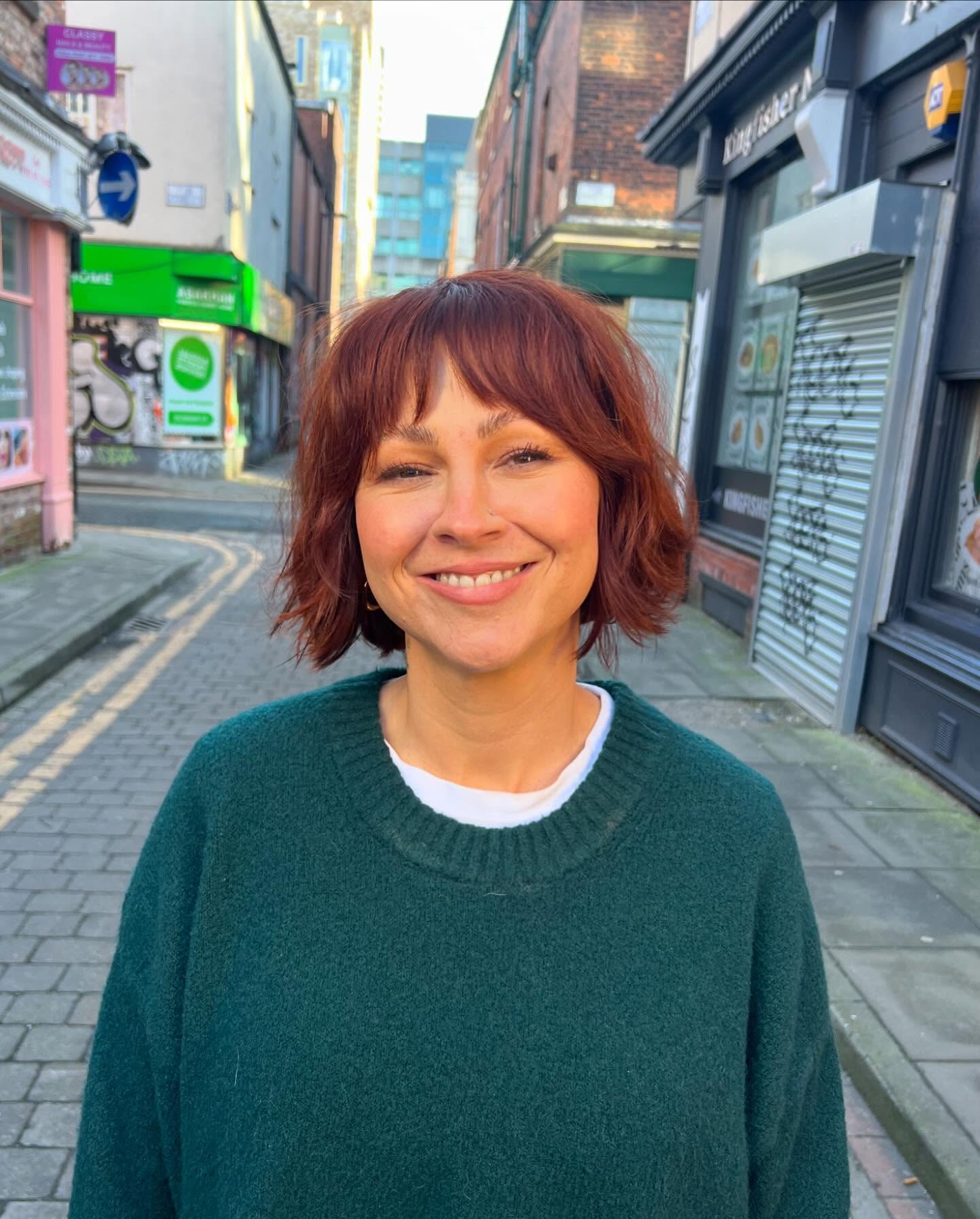 Chin-Length Razored Bob with Wispy Center-Gap Fringe