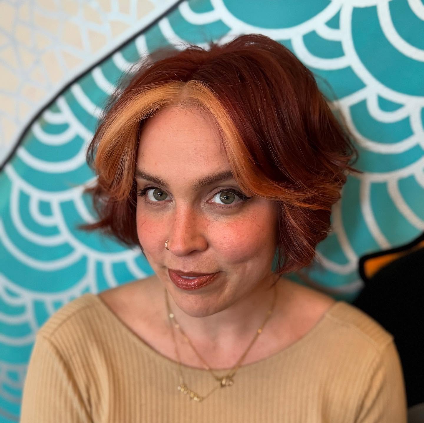 Copper Razored Chin-Length Bob with Blonde Curtain Slices