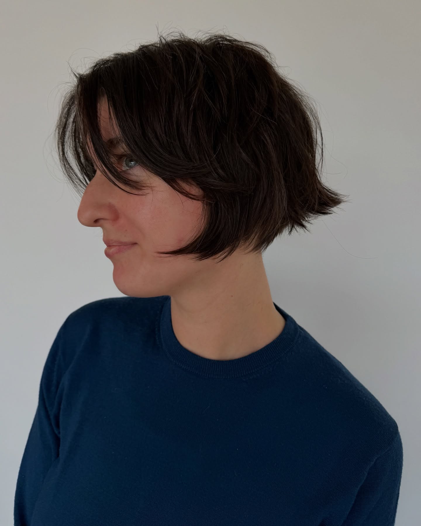 Razor-Textured Jaw-Length Bob with Curtain Face-Framing and Flared Nape