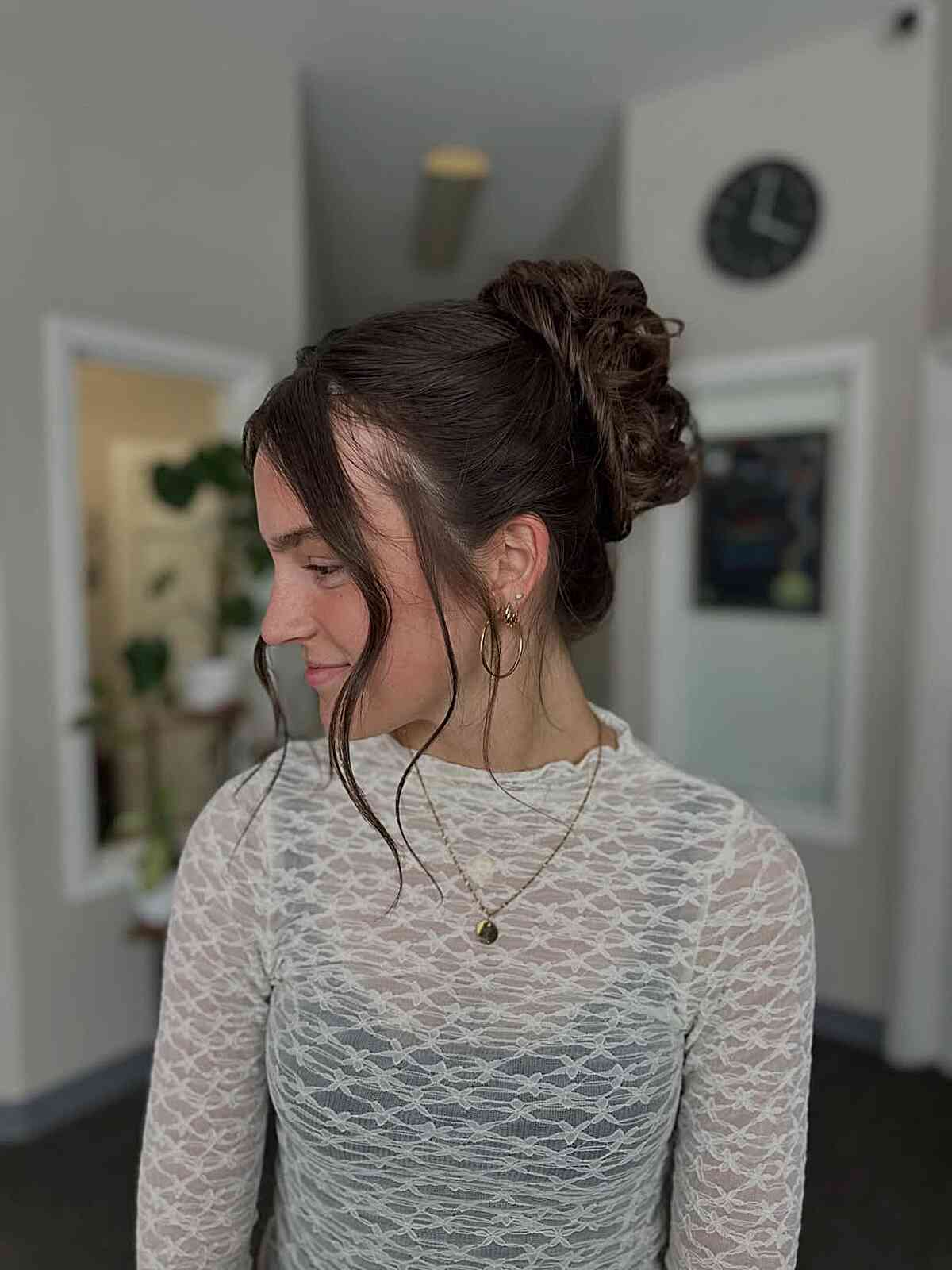 Elegant Curly Prom Updo with Face-Framing Tendrils