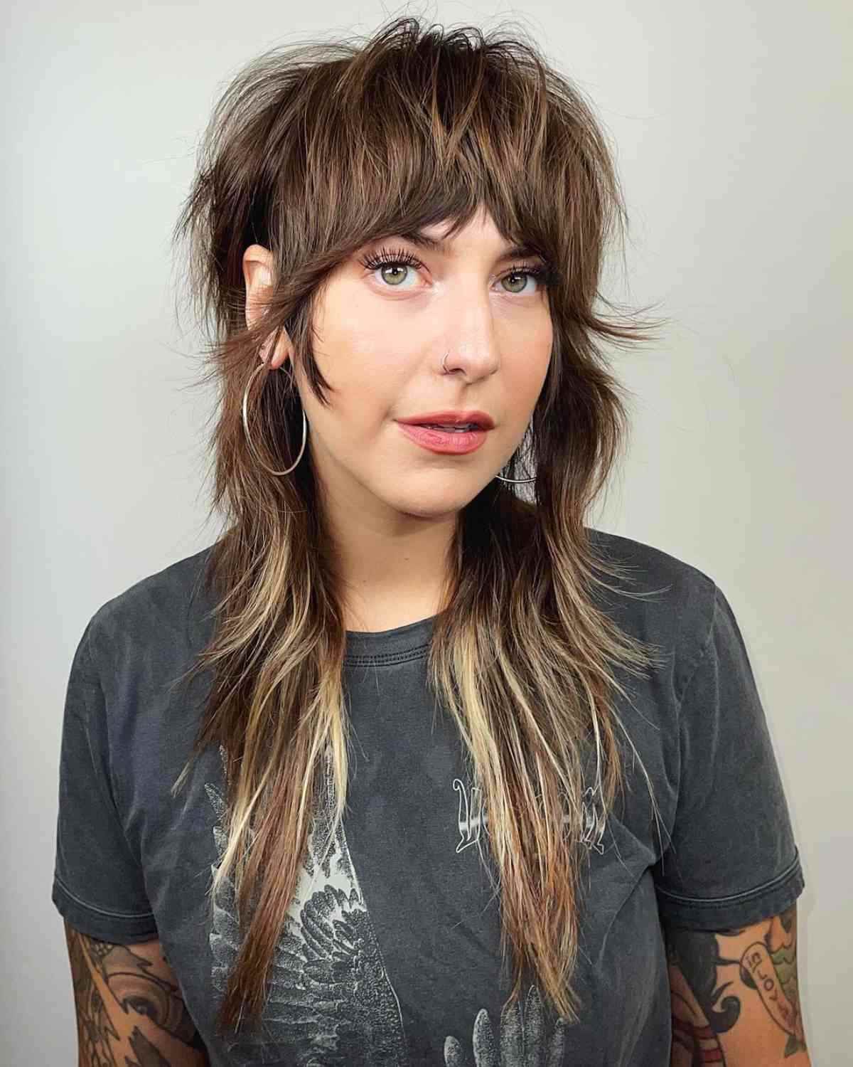 Long layered shag hairstyle with highlights and choppy layers for gender neutral people