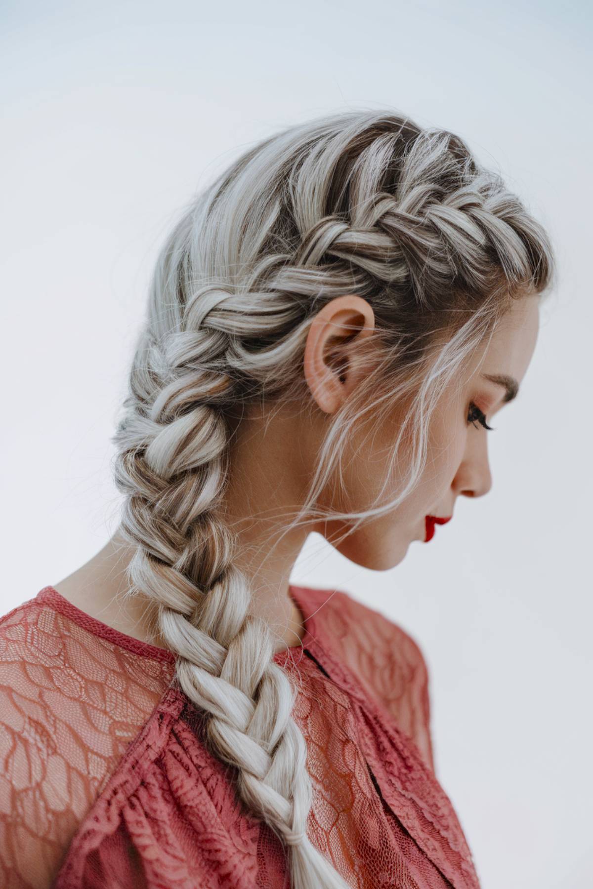 Thick, intricate Dutch braid cascading down the back, adding elegance and glam to a classic braided look