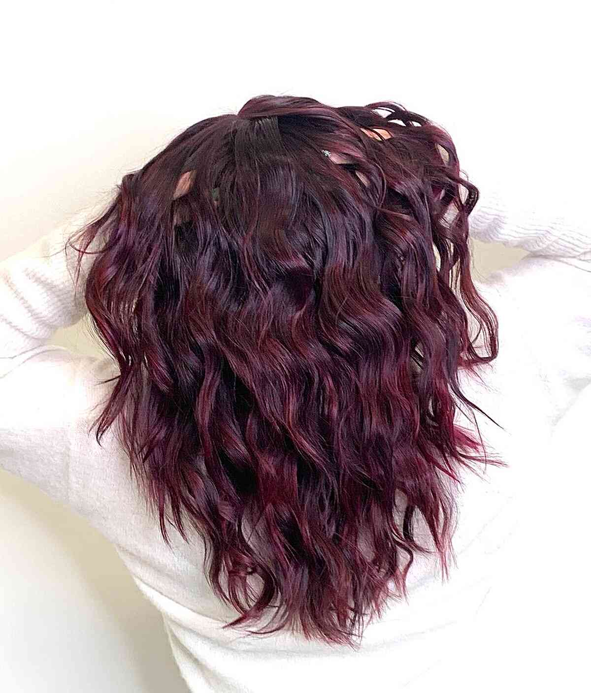 Glossy Burgundy Hair with Mid-Long Wavy Layers