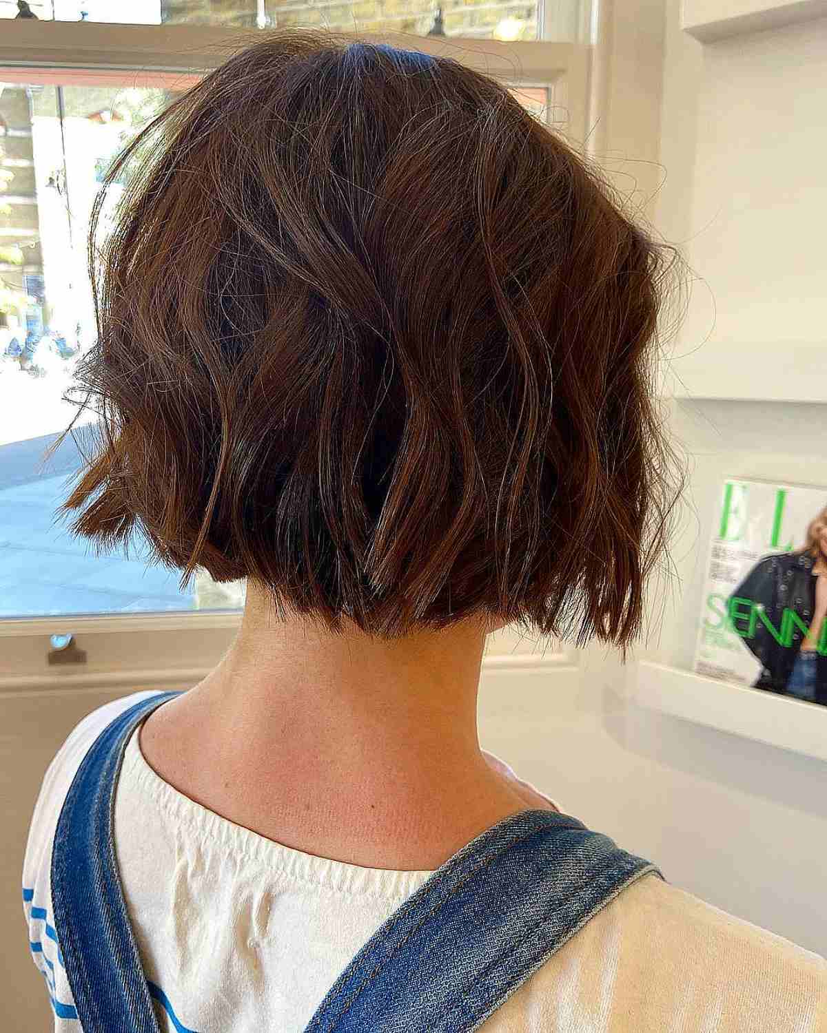 Glossy Chin-Length Brown Bob with Choppy Ends