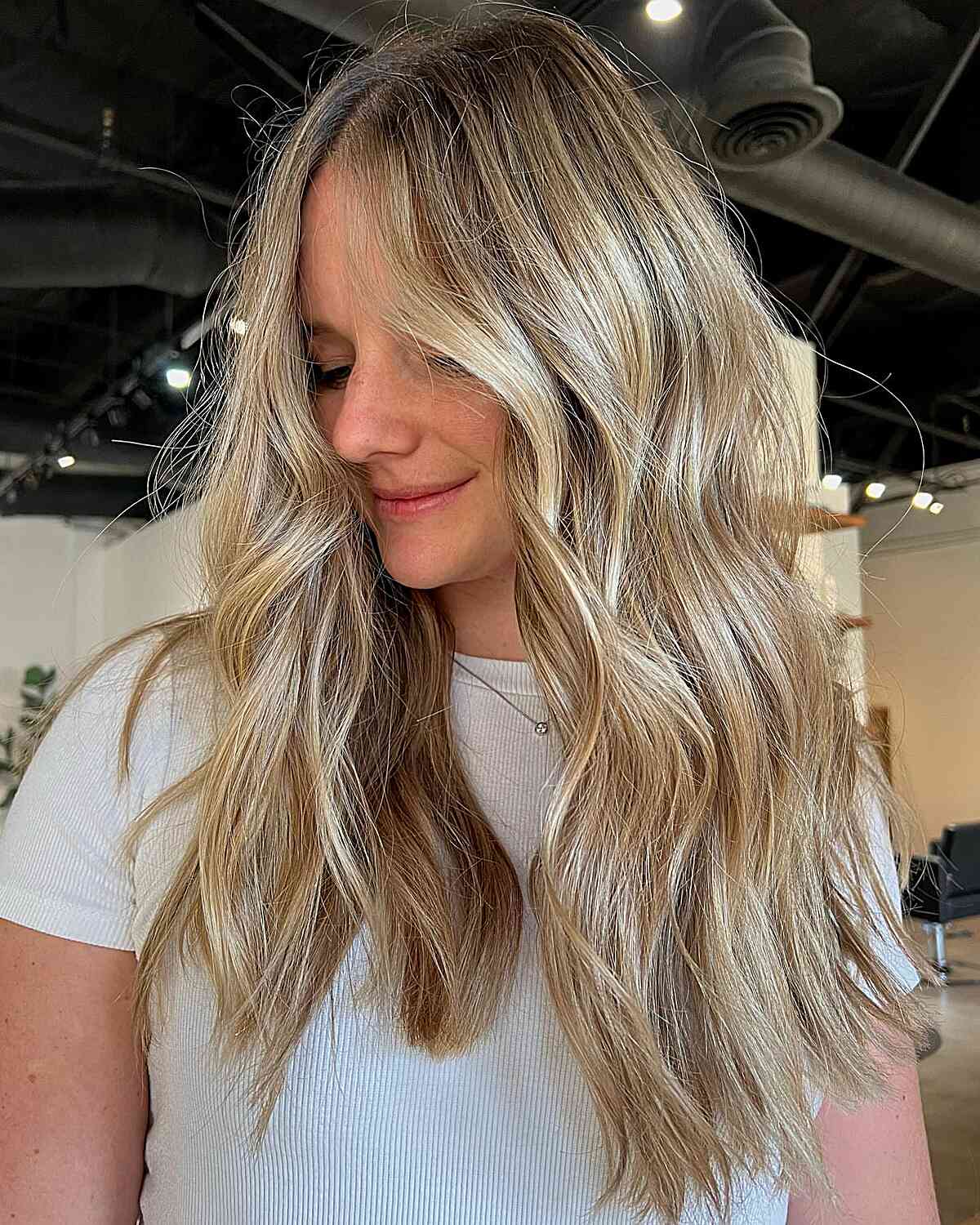 Glossy Warm Blonde Babylights Balayage with Shadow Root for Mid-Long Hair