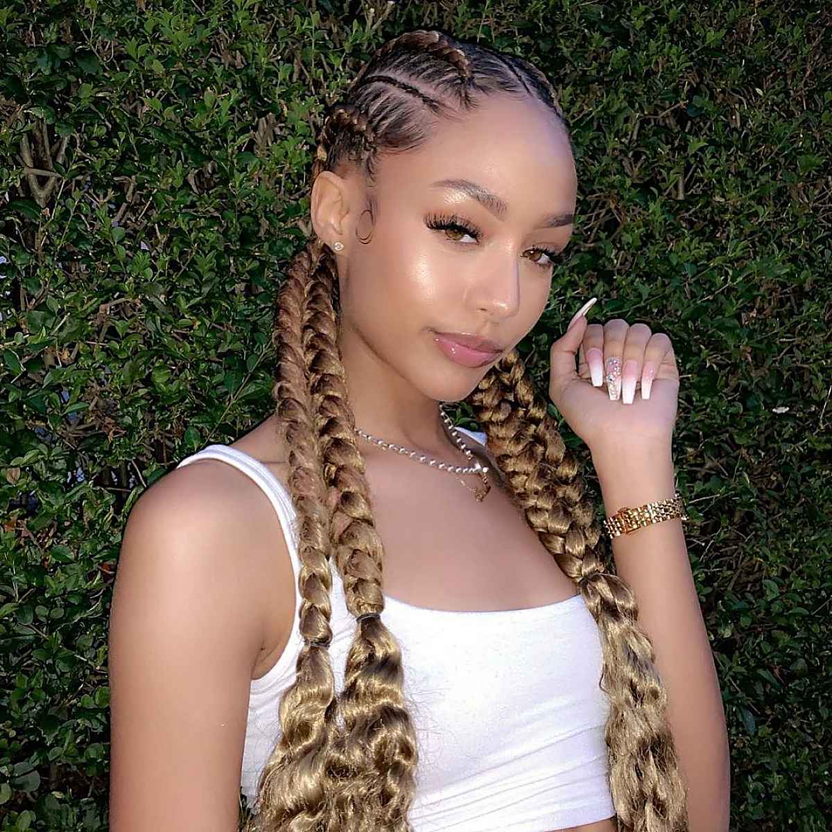 Goddess braids style with low pigtails
