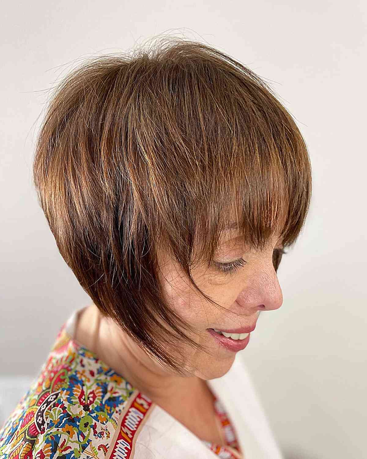 Golden Brown Graduated Wispy Bob with Bangs for Thin-Haired Women Over 60