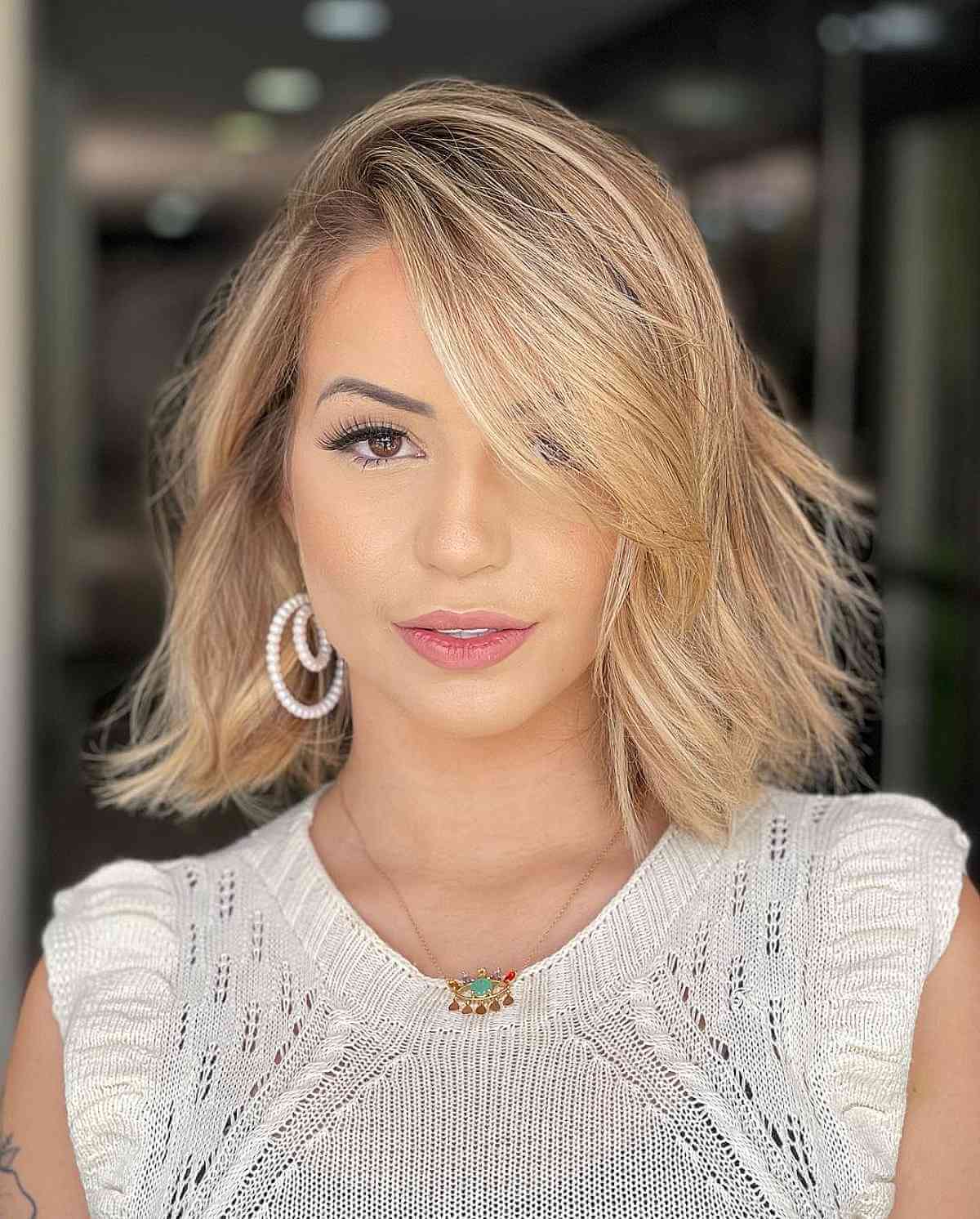 Gorgeous Blonde Bob with a Side Part and a Swoop Bang