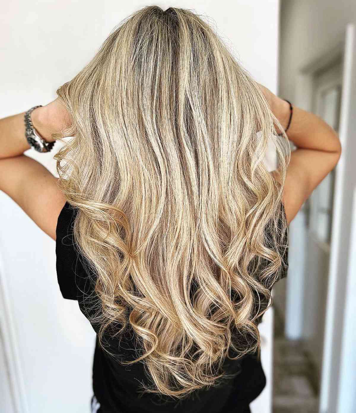 Gorgeous Blonde V-Cut Layers with Curled Ends