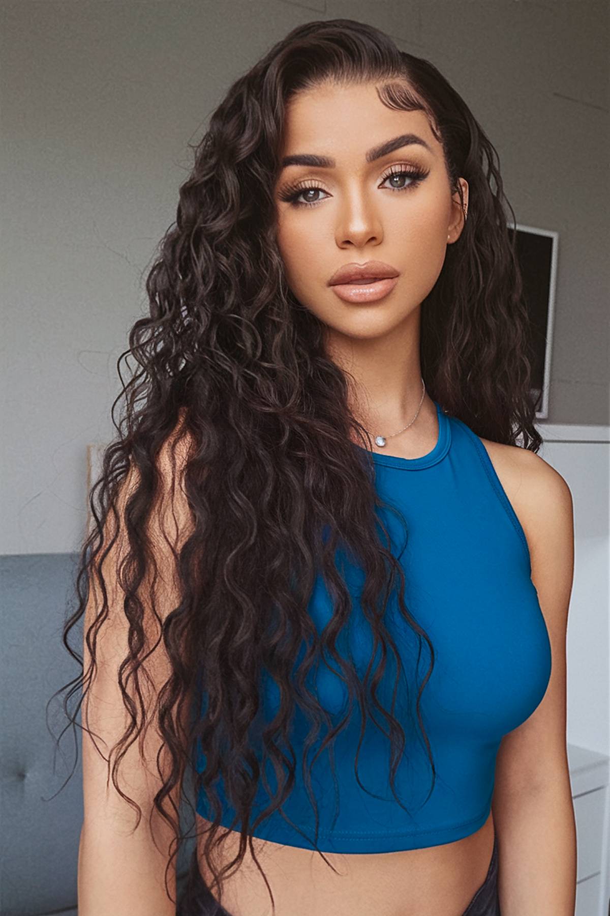 Long curly hairstyle with side part showcasing bouncy, defined curls