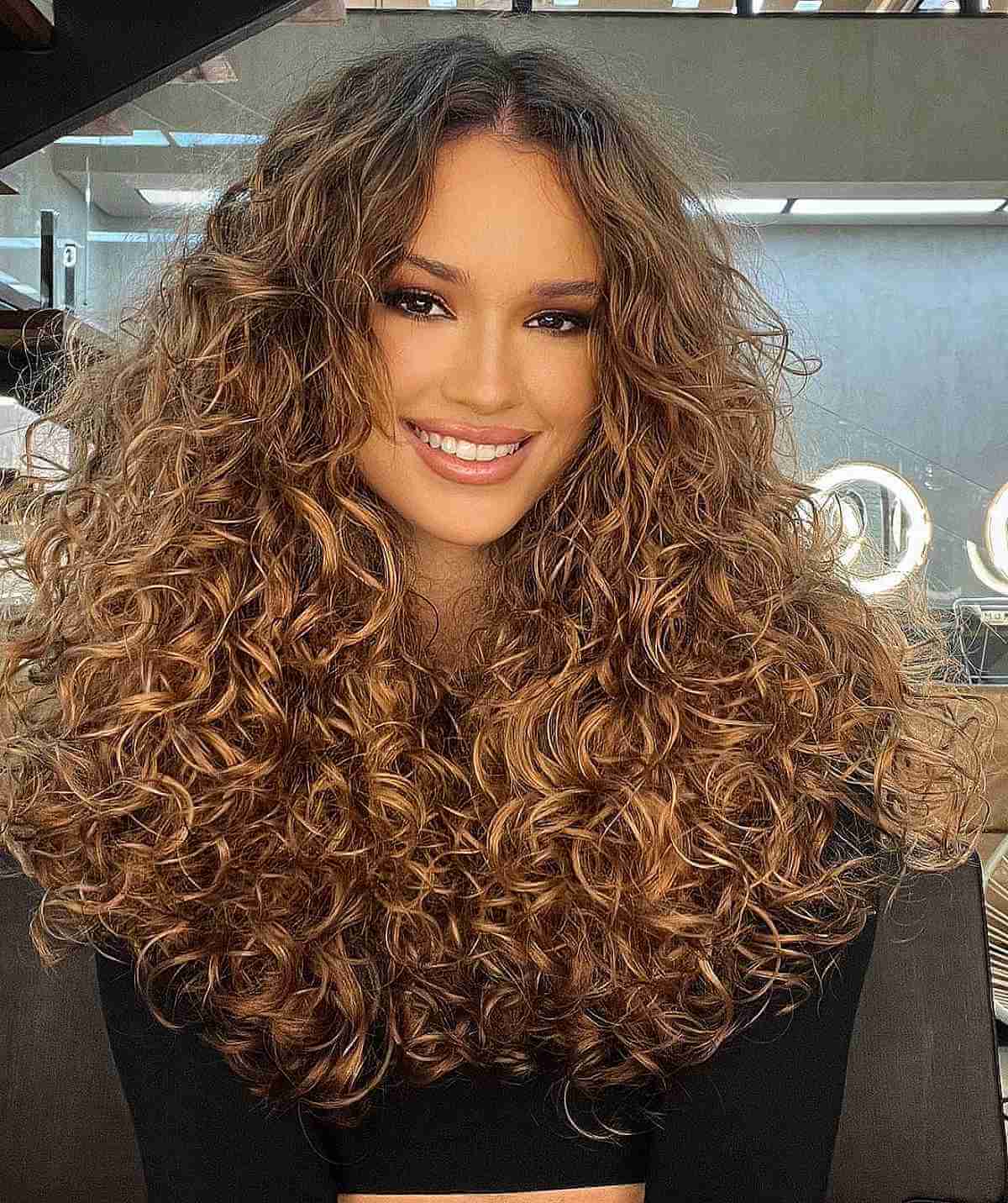 Gorgeous Thick Curls with Sun-Kissed Balayage