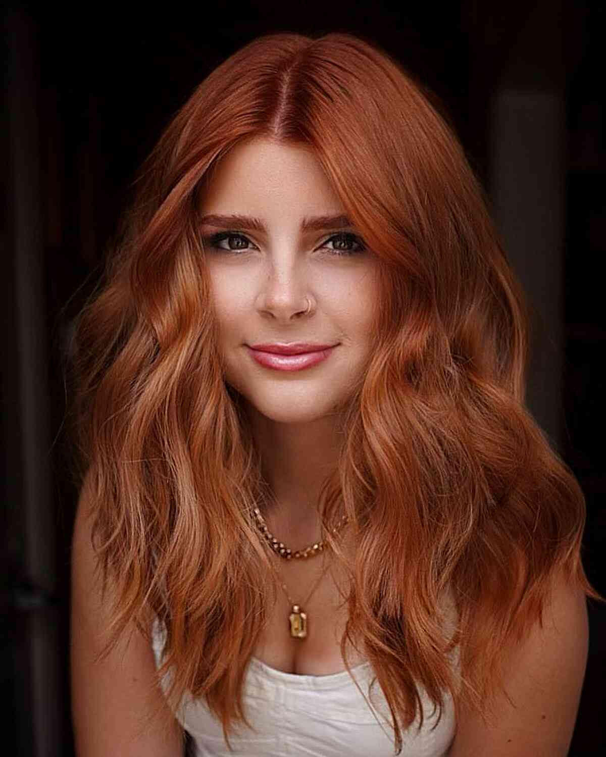 Gorgeously Layered Copper Mid-Length Hair with Choppy Ends and a Middle Part