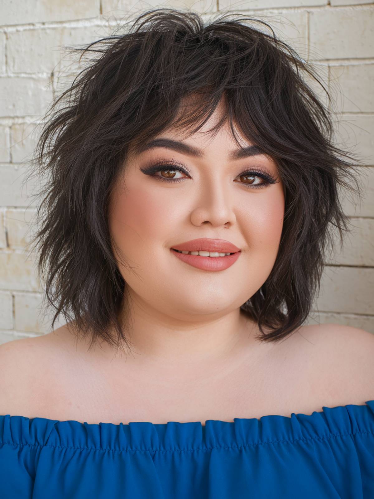 Soft shag cut for plus-size women with choppy layers and wispy bangs