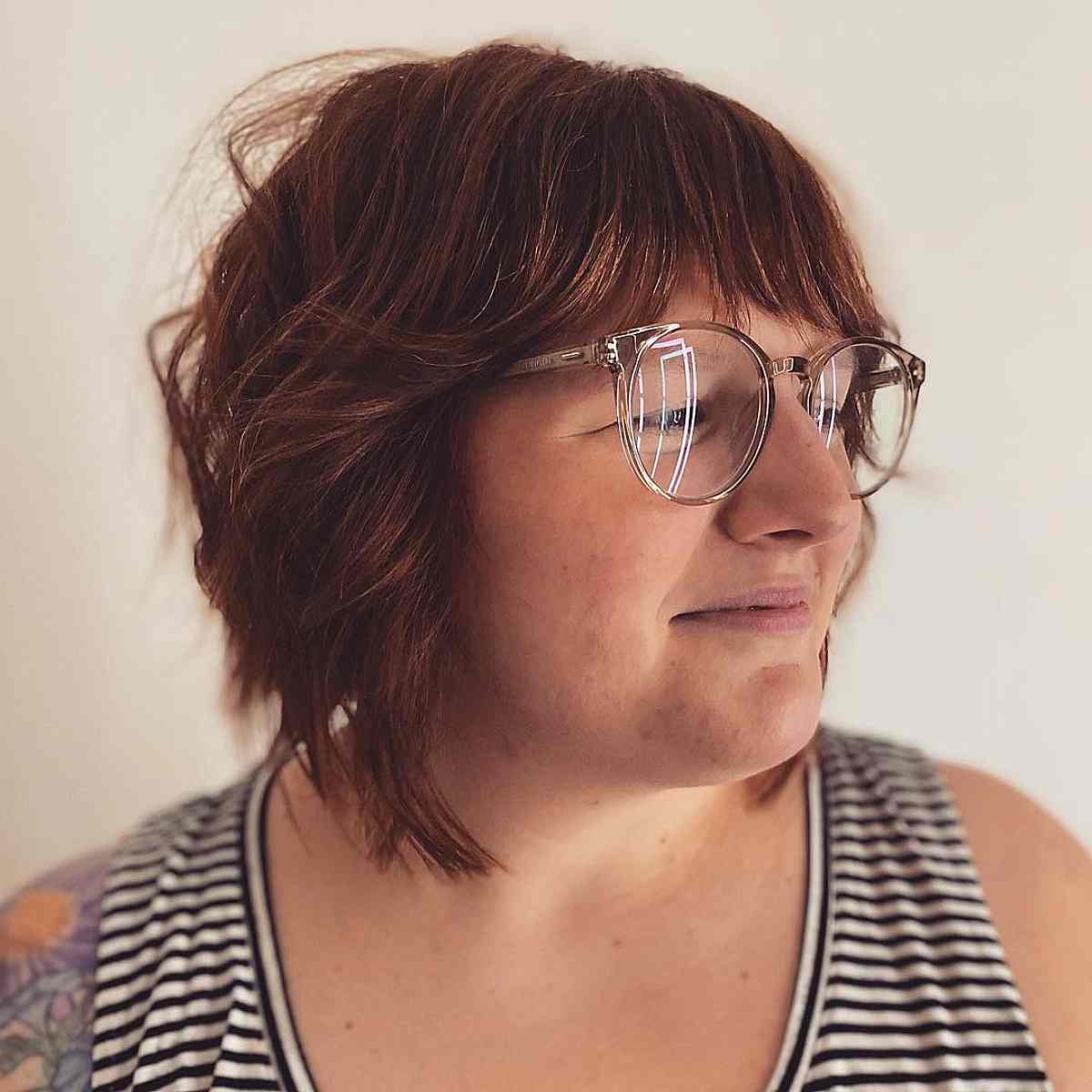 Graduated and Layered Shaggy Bob with Bangs for a Chubby Face