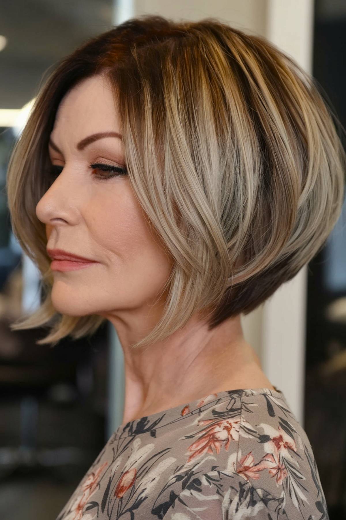 Graduated bob with stacked layers, offering a modern and lifted look, perfect for women over 50