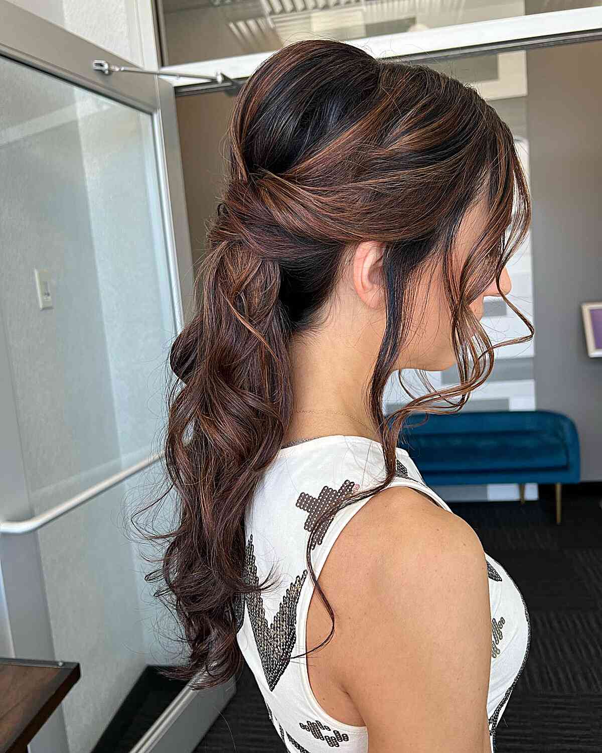 Graduation Style Bumped and Twisted Low Ponytail for Mid Back-Length Brunette Hair