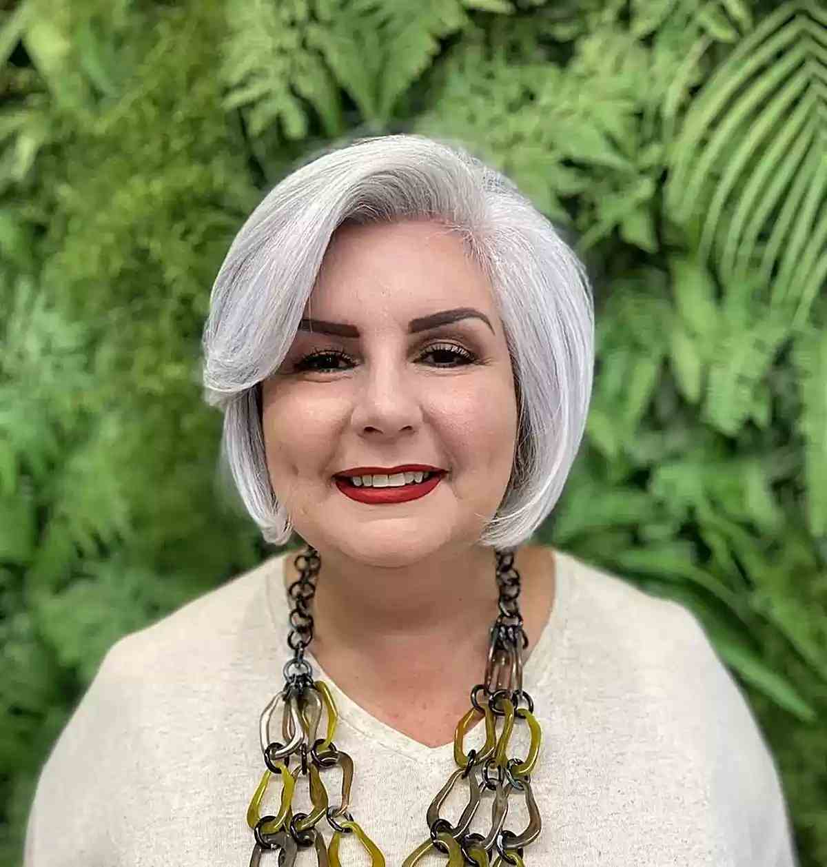 Gray Chin Bob with Side Bangs on Older Women Over 60 with Round Faces
