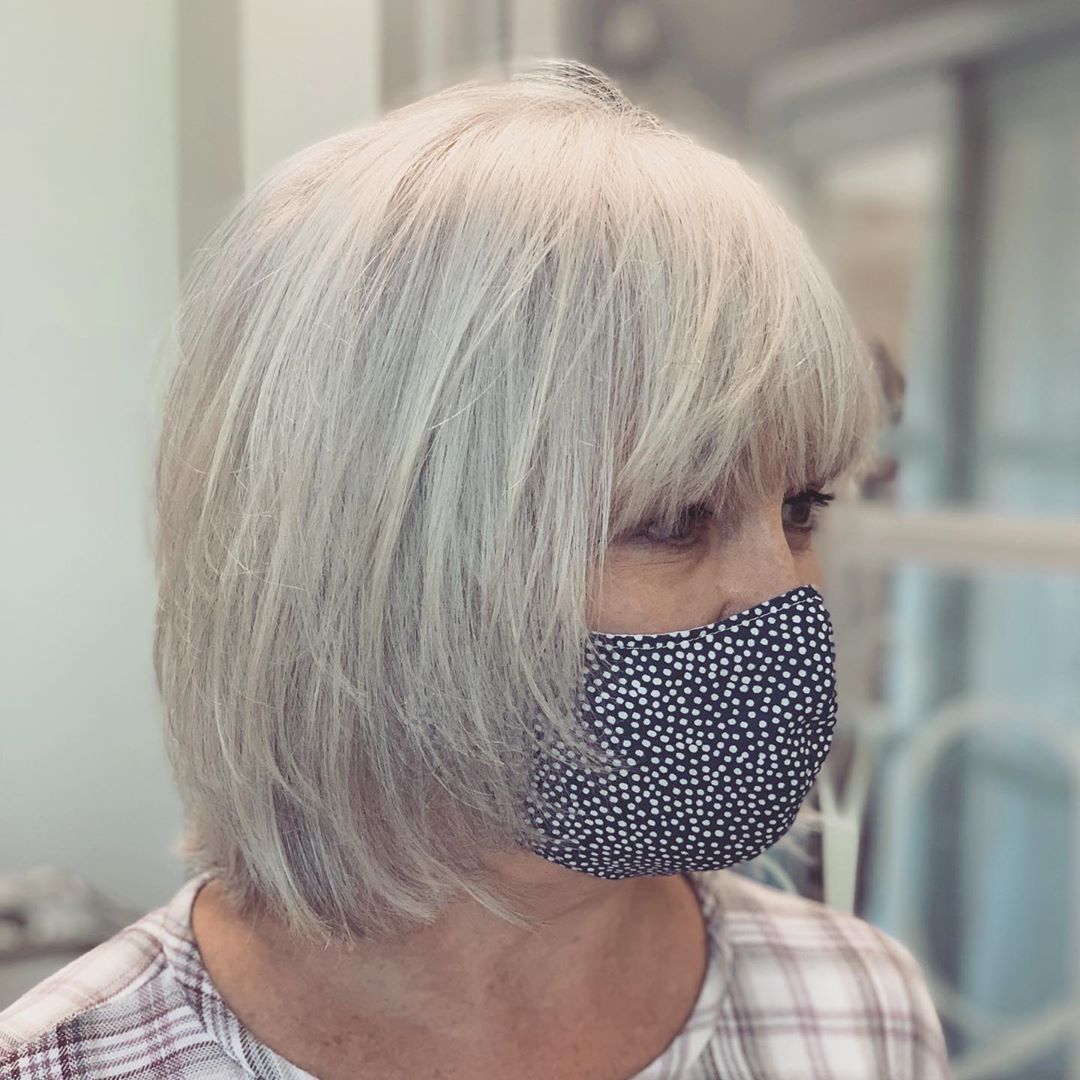 Grey Layered Shag Haircut for Women Over 55 with Fine Hair