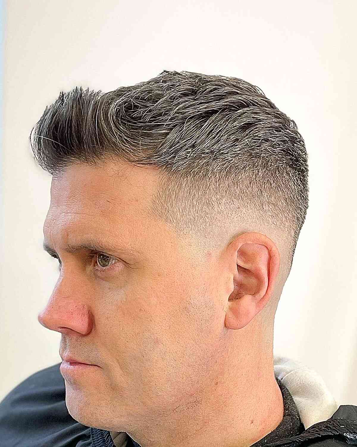 Grey Textured Top with Short Sides and Brushed-Up Bangs for Men Over 40
