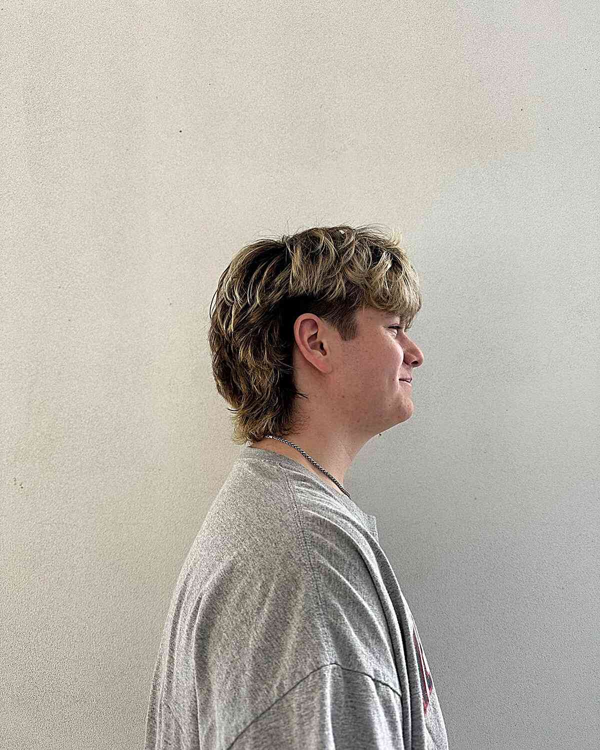 Grown-Out Medium Mullet Undercut with Frosted Highlights for Young Guys