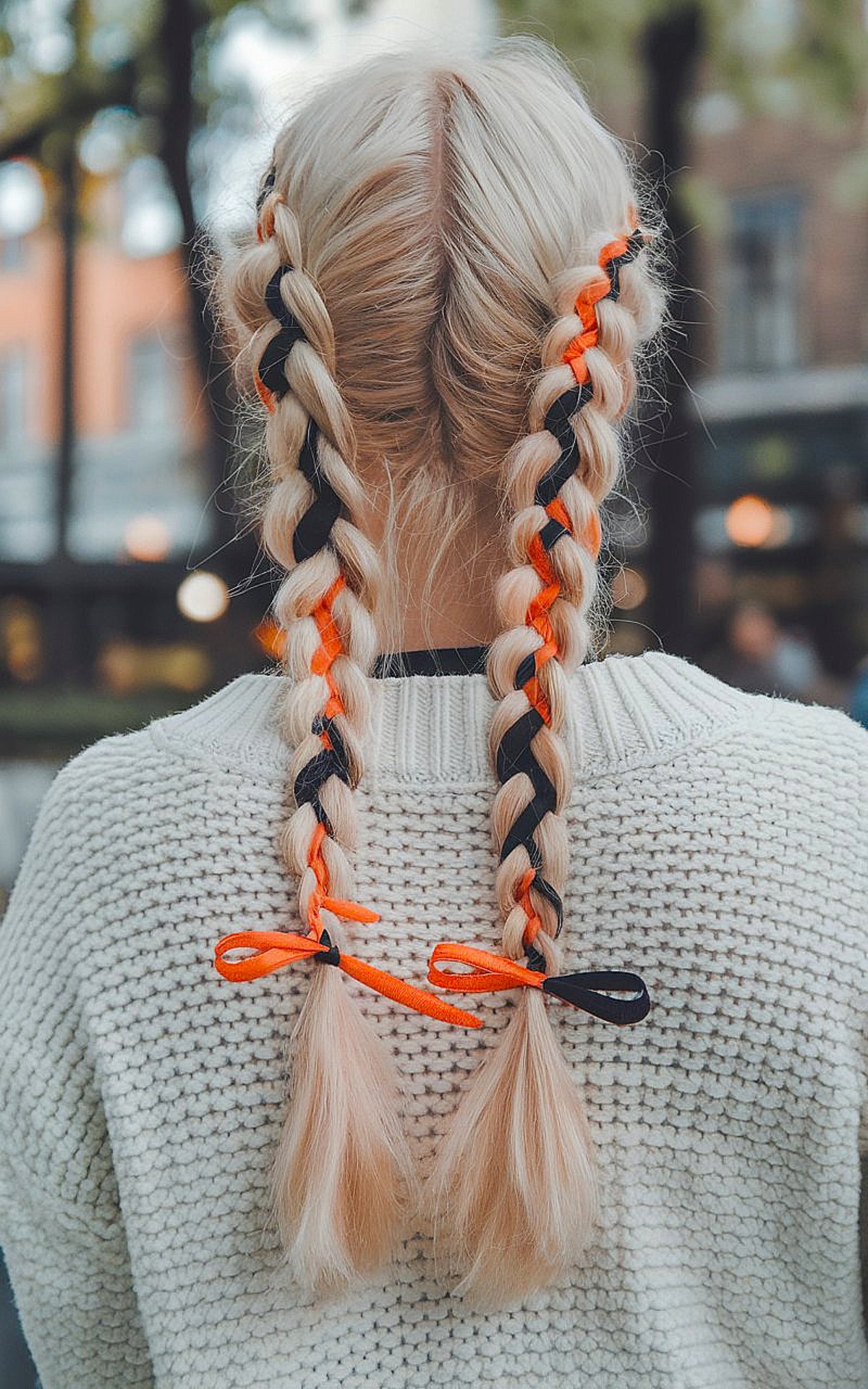 Long hair Halloween style with braids and black and orange ribbons