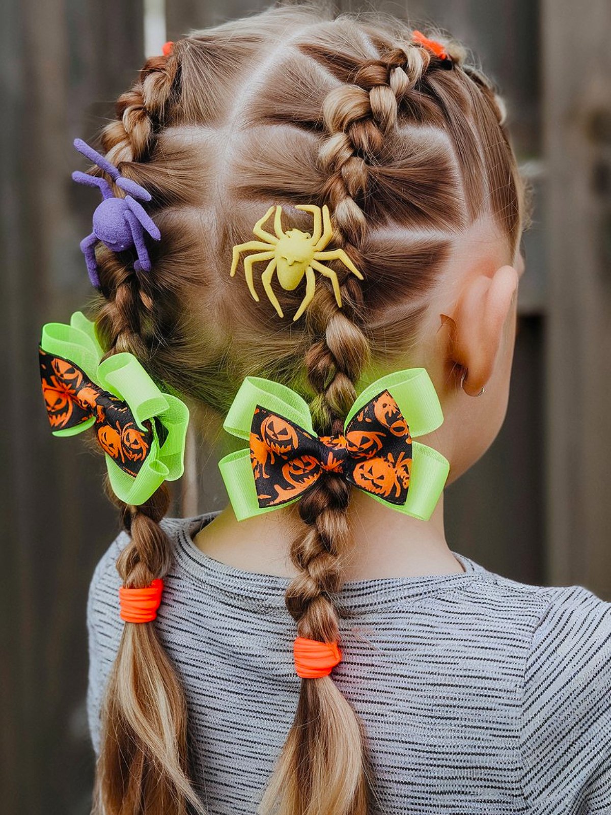 Toddler Halloween hair with braids, spider clips, and pumpkin bows