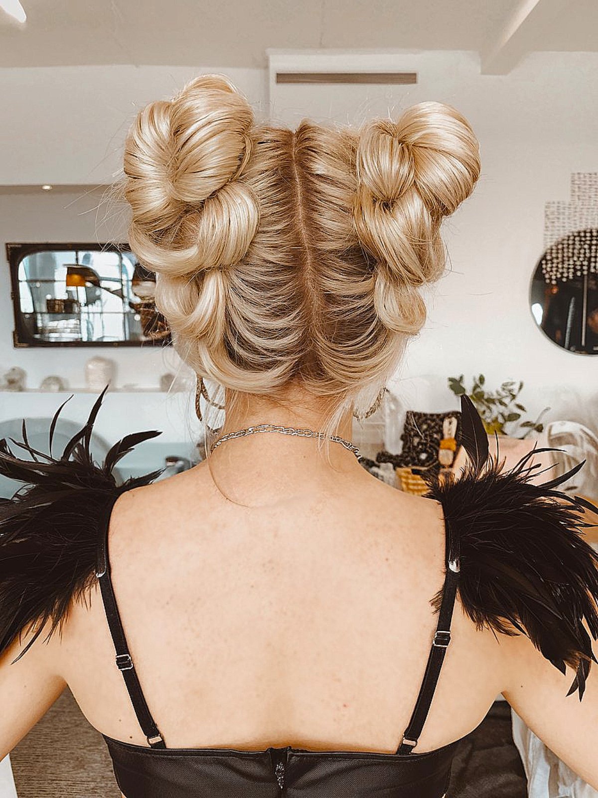 Updo Halloween hair with double messy buns for witchy costumes