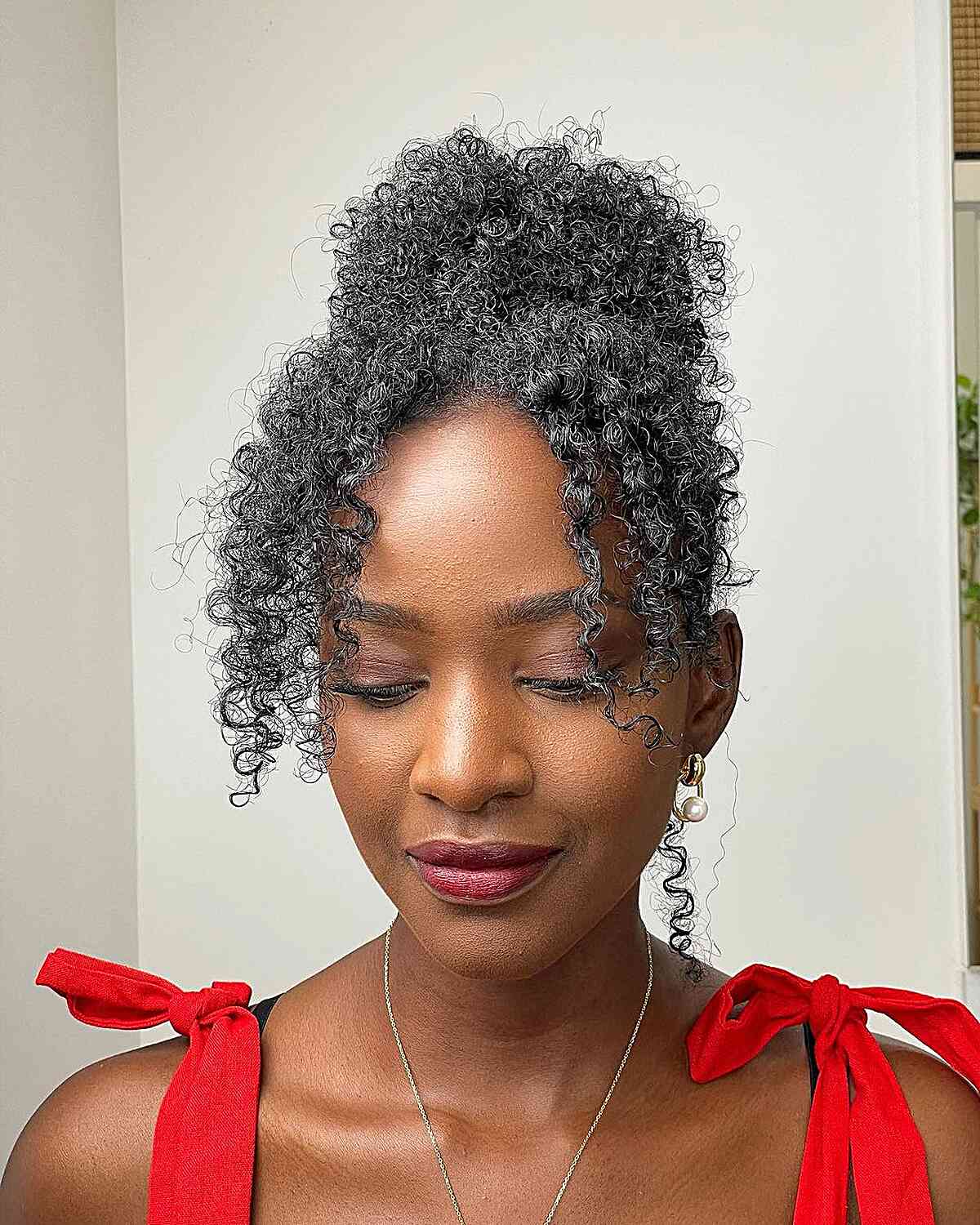 High Bun Updo with Curly Curtain Bangs for Black Women