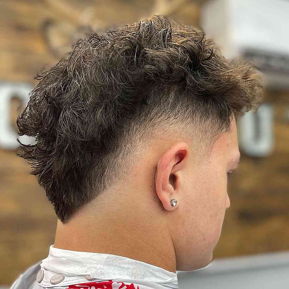 High Burst Fade with Textured Top on Men