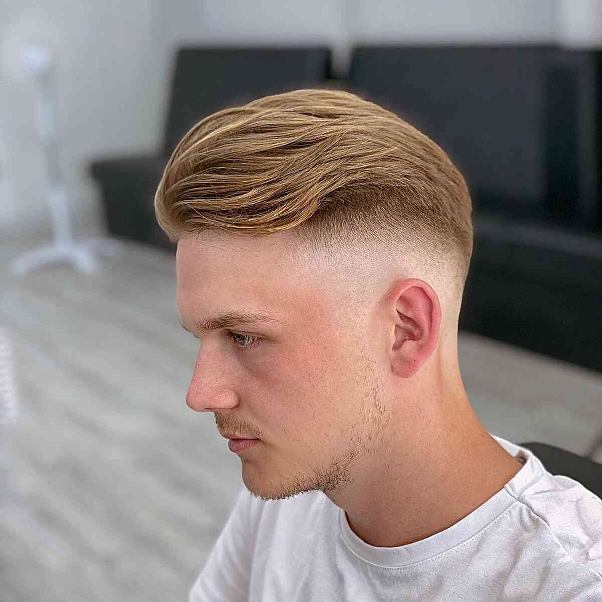 High Skin Fade for Wavy Side Quiff on Men's Thick, Blonde Hair
