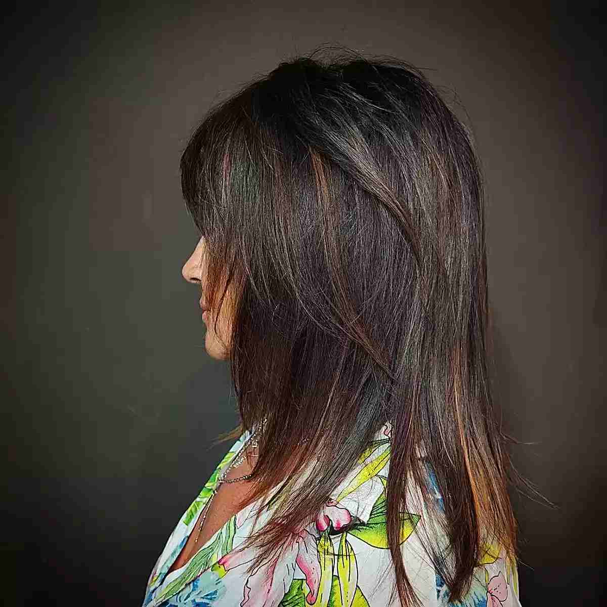 Shoulder-Length Highlighted Brunette Hair with Wispy Layers for Older Ladies Over 60